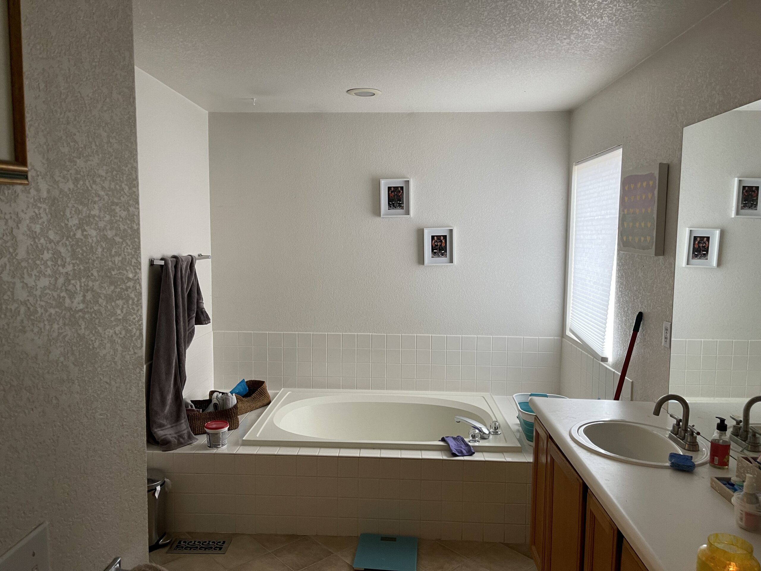 DATED bathroom with deep tub and unused space